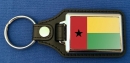 Guinea-Bissau Schlüsselanhänger aus Metall und Kunstleder | ca. 95 X 37  mm